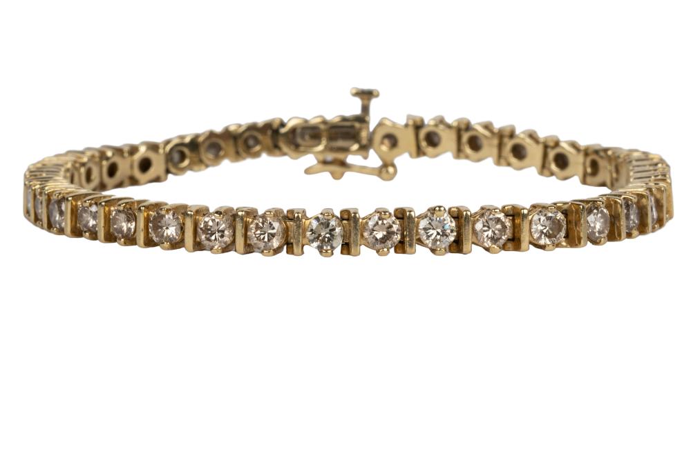 Appraisal: KARAT YELLOW DIAMOND STRAIGHTLINE BRACELETcontaining full cut diamonds P-R-Faint Brown