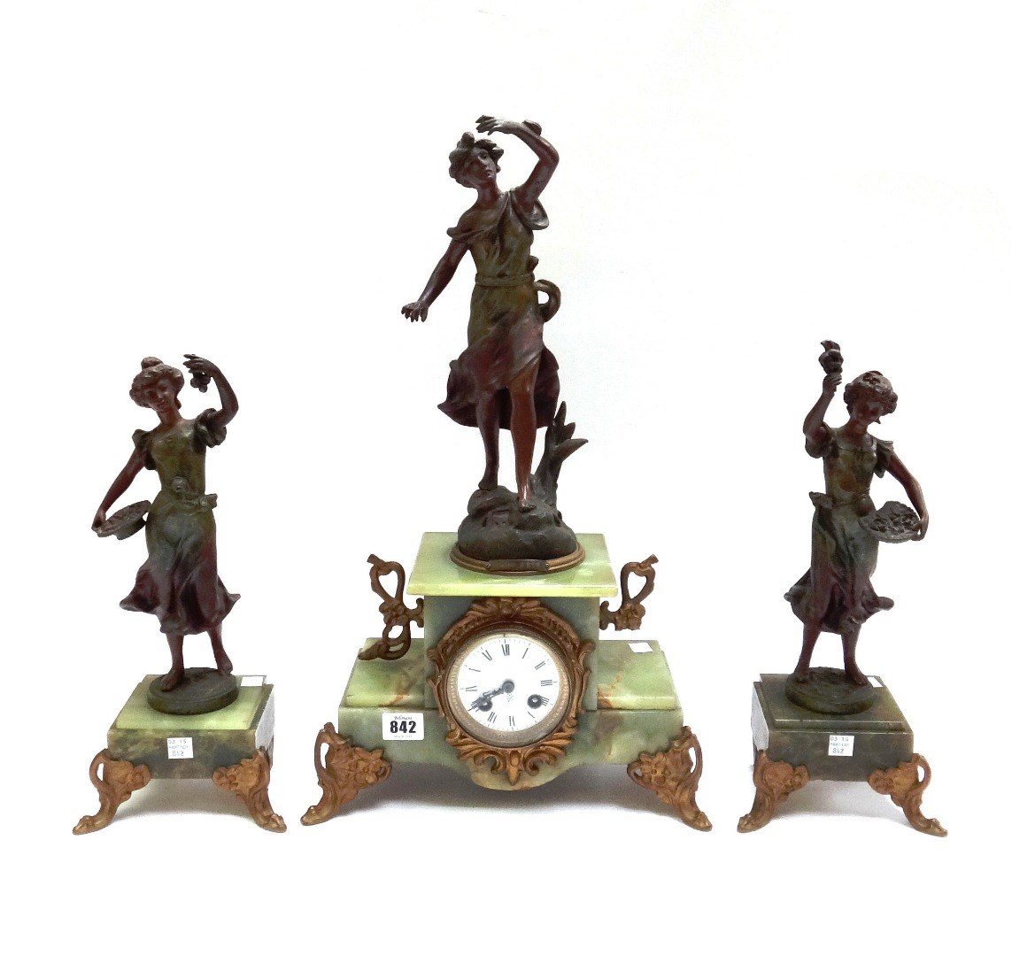 Appraisal: A onyx and spelter mounted figural clock garniture early th