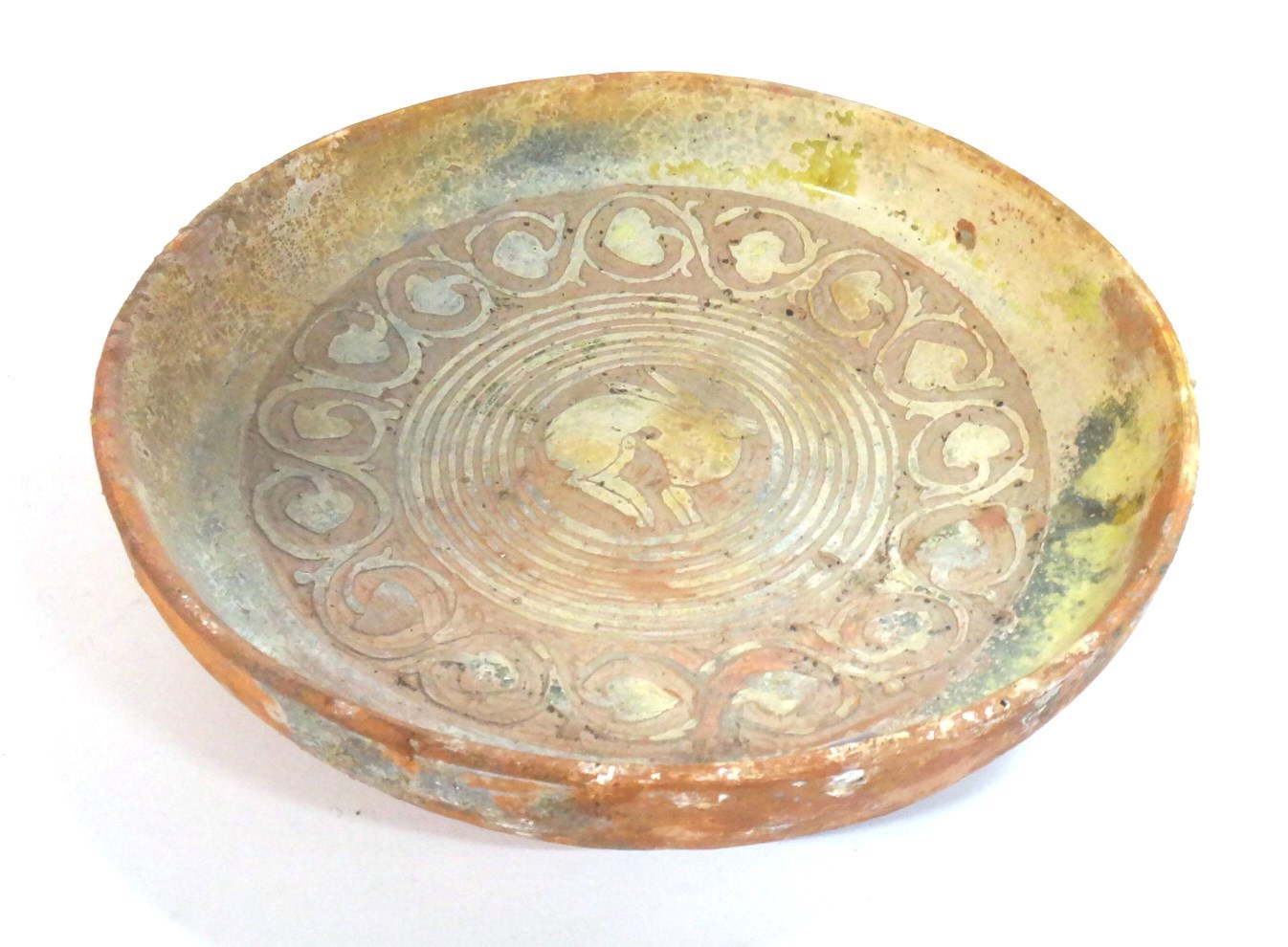 Appraisal: A Byzantine style red pottery shallow bowl carved with a