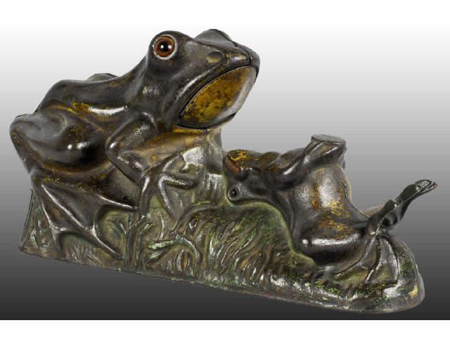 Appraisal: Cast Iron Two Frogs Mechanical Bank Description Glass eyes Replaced