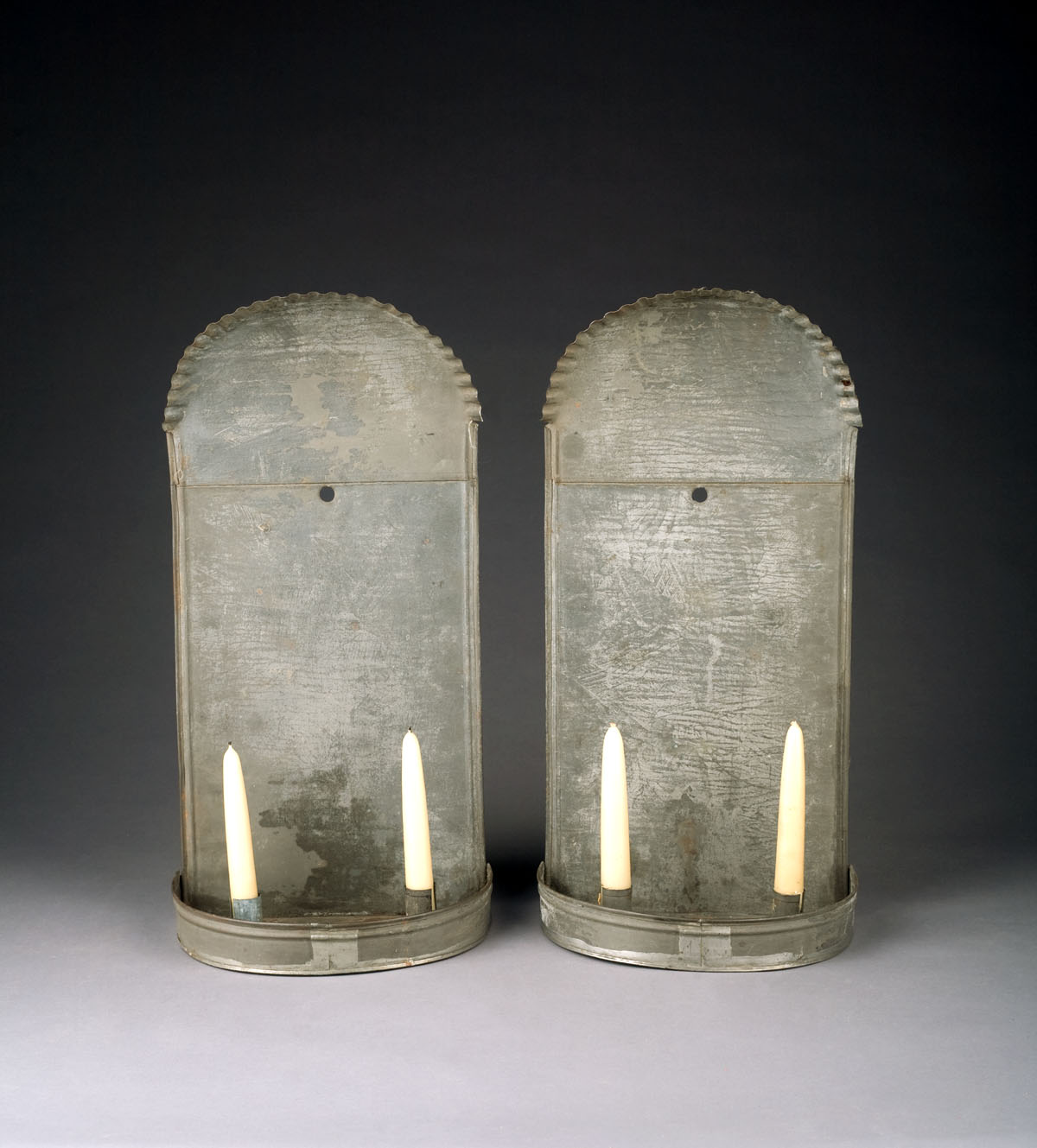 Appraisal: PAIR OF EARLY AMERICAN TIN DOUBLE SCONCES WITH CRIMPED TOPS