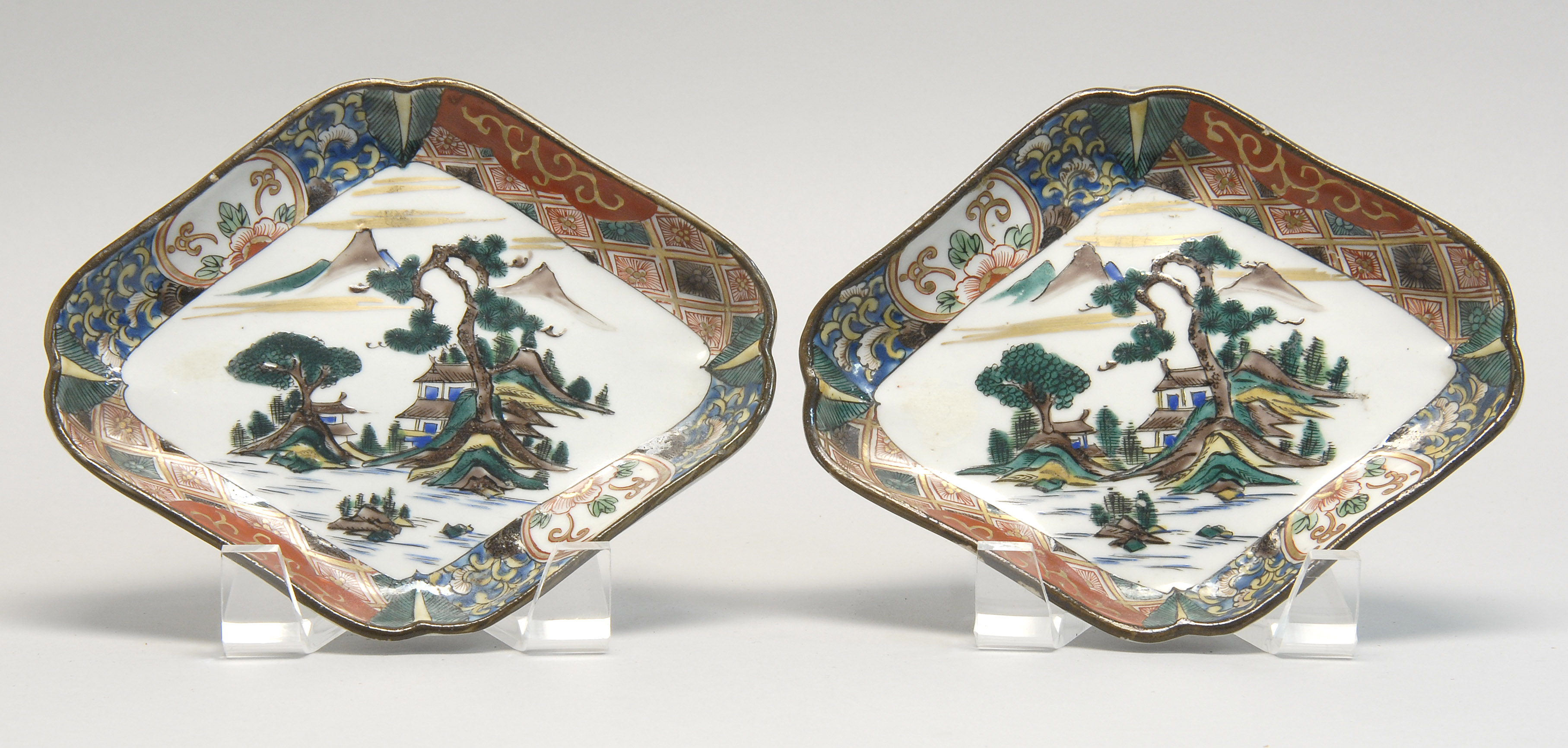 Appraisal: PAIR OF AO KUTANI DISHES In lozenge form with landscape