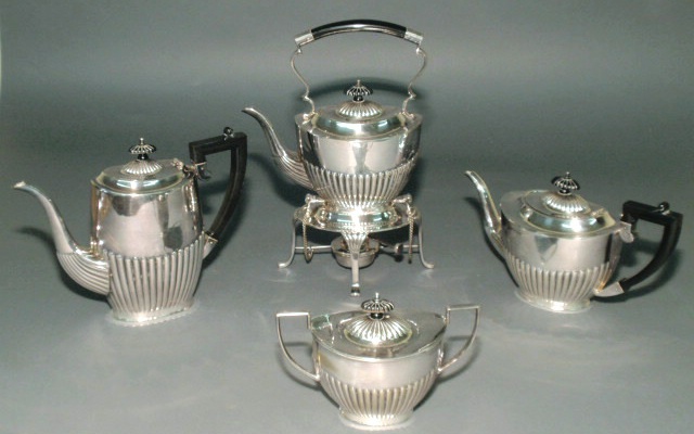 Appraisal: Silverplate tea service made in Sheffield England- kettle-on-stand h coffeepot