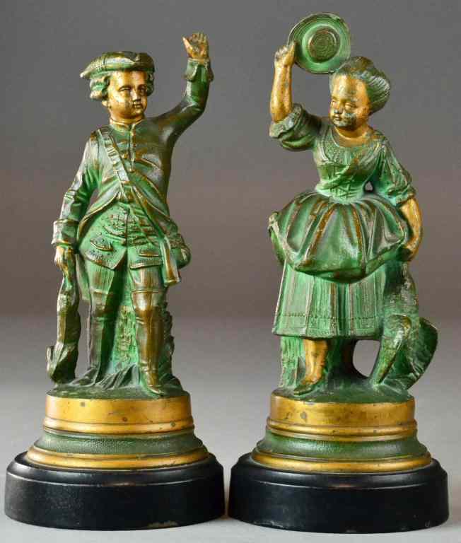 Appraisal: Pr Of th Century Dress Spelter StatuesWith a young man