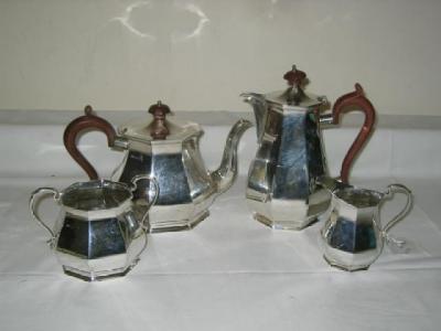 Appraisal: A FOUR PIECE TEA SERVICE the teapot of octagonal form