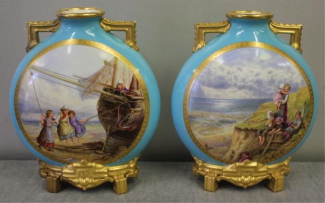 Appraisal: ROYAL WORCESTER Pair of Decorated Porcelain Urns Nice quality and