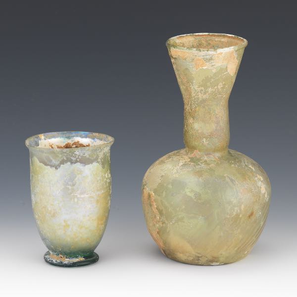 Appraisal: TWO ROMAN GLASS VESSELS Iridescent colored blown glass items including