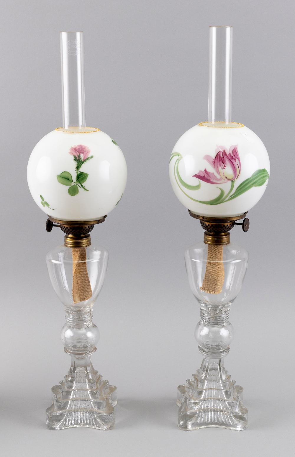 Appraisal: PAIR OF CLEAR SANDWICH GLASS LAMPS MID- TH CENTURY HEIGHTS