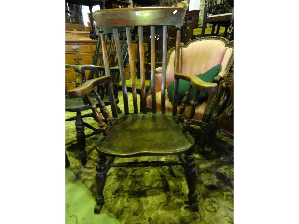 Appraisal: A Victorian stained elm and beech wood kitchen elbow chair