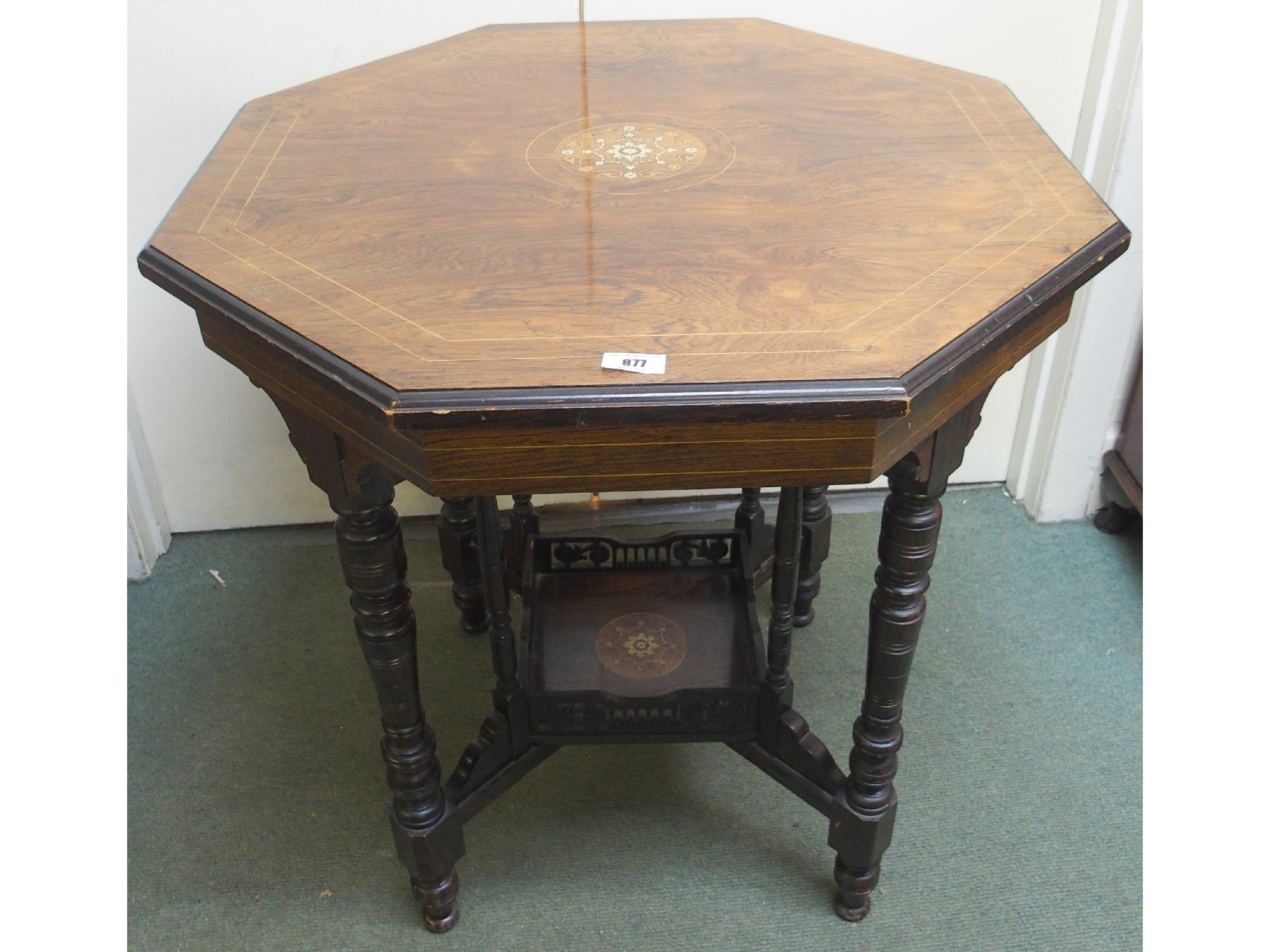 Appraisal: A Victorian rosewood octagonal two-tier occasional table