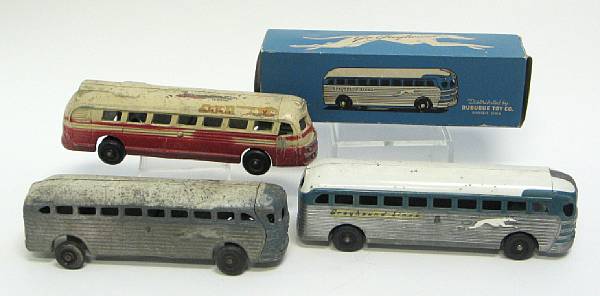 Appraisal: Metal Bus Grouping Boxed Ertl metal Greyhound bus accompanied with