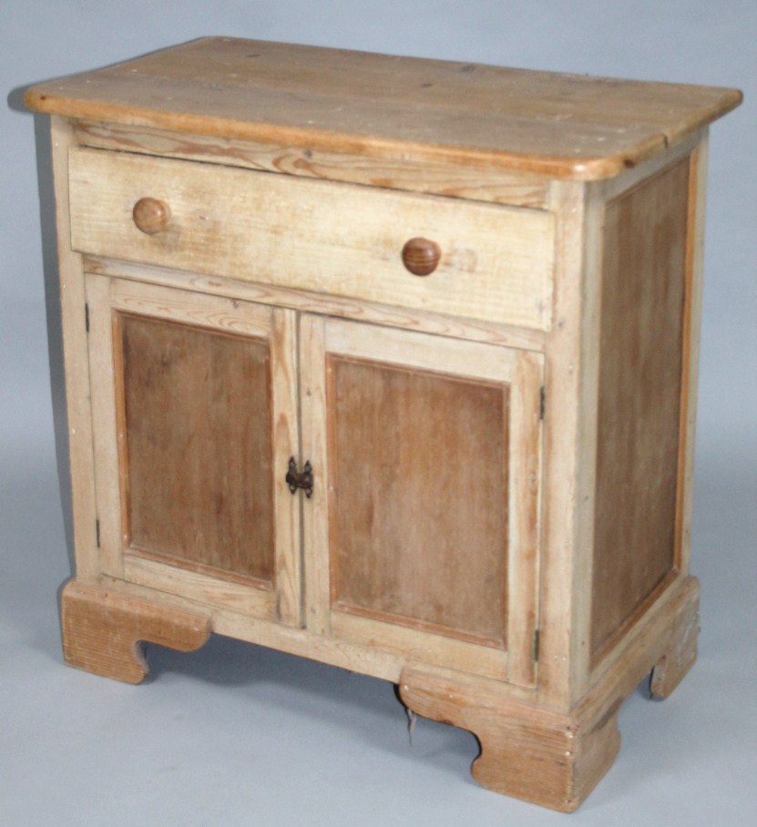 Appraisal: A stripped and lightly polished reclaimed pine side cabinet with