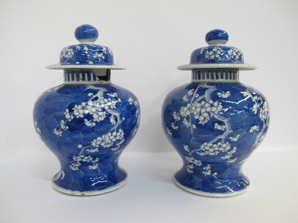 Appraisal: Two Chinese blue and white prunus decorated jars and covers