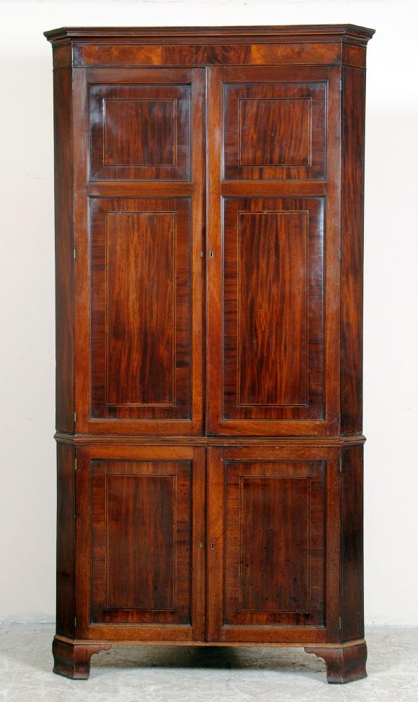 Appraisal: A GEORGE III MAHOGANY STANDING CORNER CUPBOARD c the cavetto