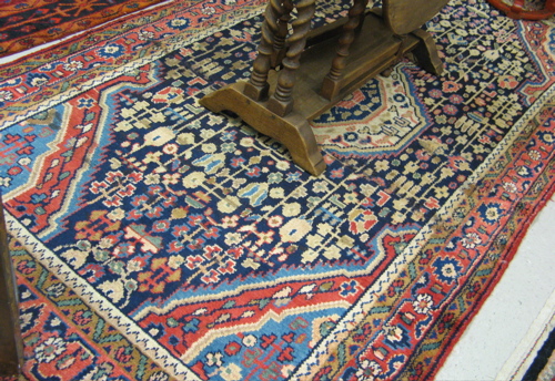 Appraisal: PERSIAN AREA RUG northwestern tribal medallion and stylized floral design