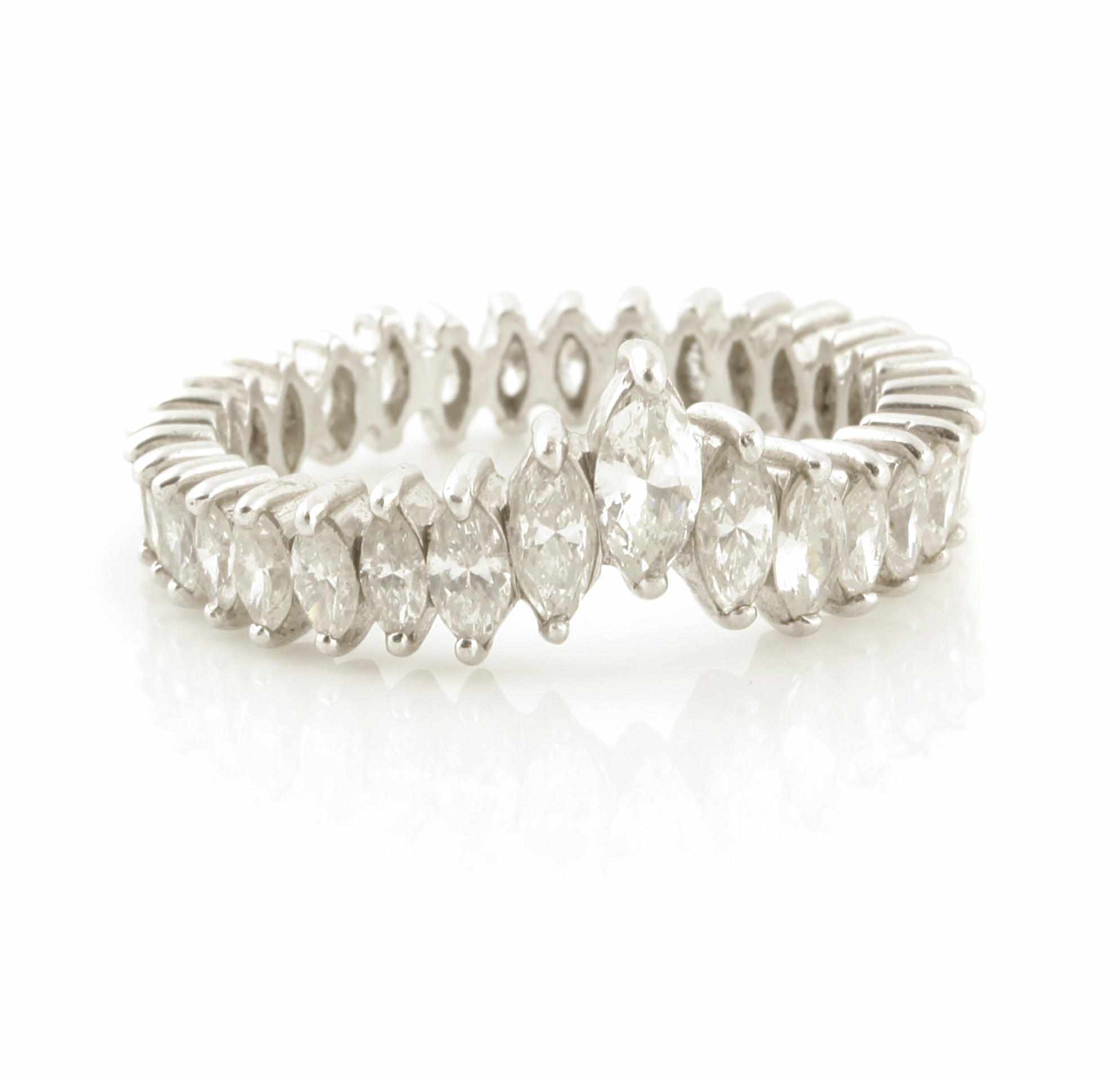 Appraisal: A diamond and platinum eternity band set with marquise shape