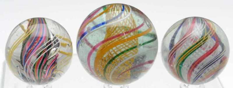 Appraisal: Lot of Swirl Marbles Largest marble is a yellow latticino