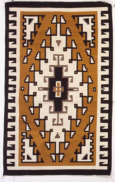 Appraisal: A Navajo Two Grey Hills rug Centering a concentric diamond