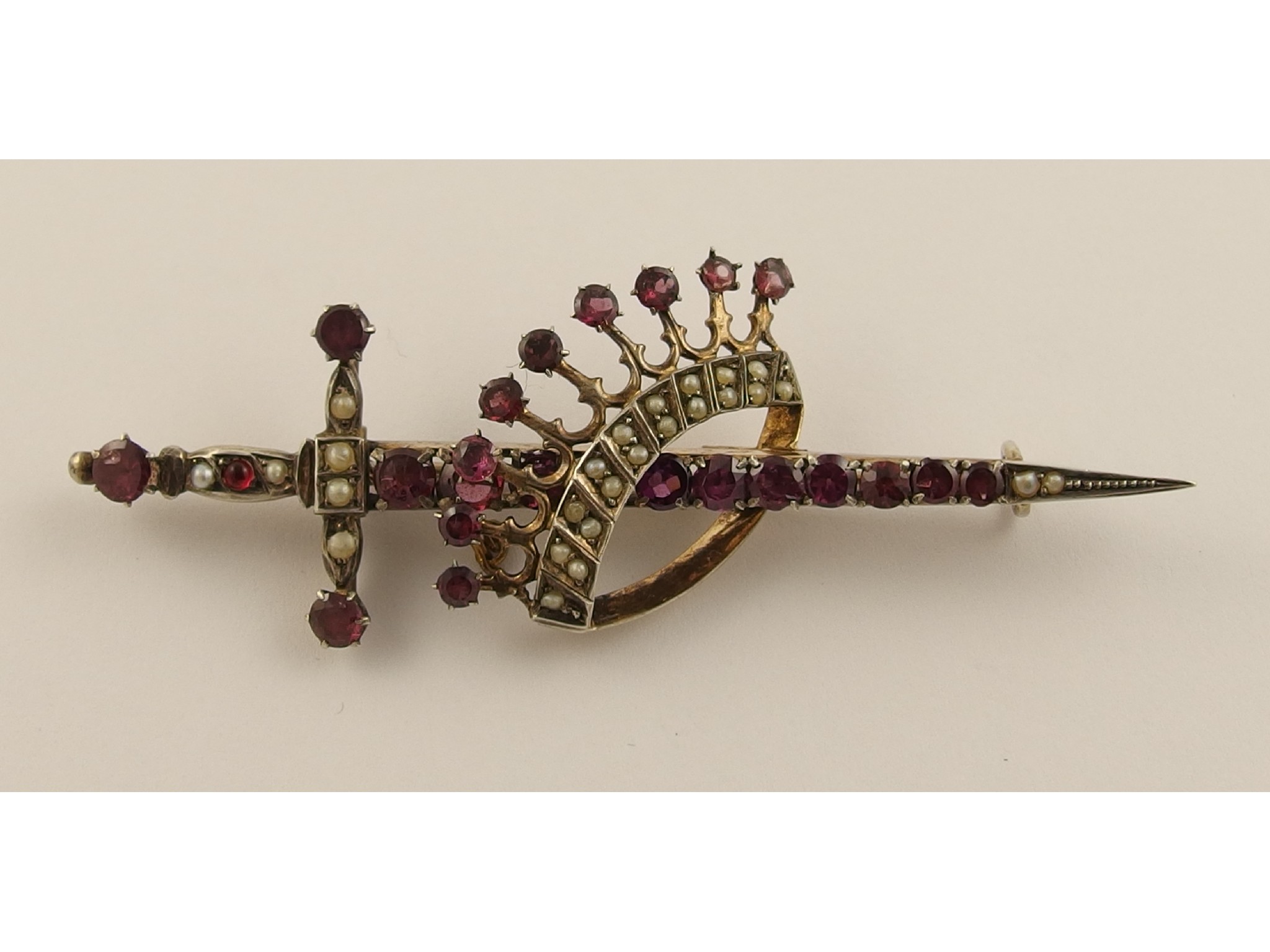 Appraisal: A silver gilt crown and sword brooch set with pearls