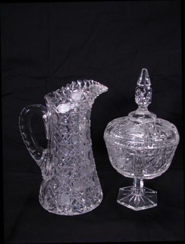 Appraisal: Cut glass water pitcher and cut pressed glass lidded pedestal