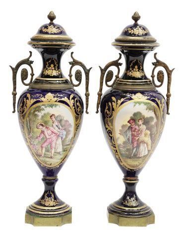 Appraisal: lot of Sevres style ormolu-mounted porcelain urns cobalt-blue glazed ground