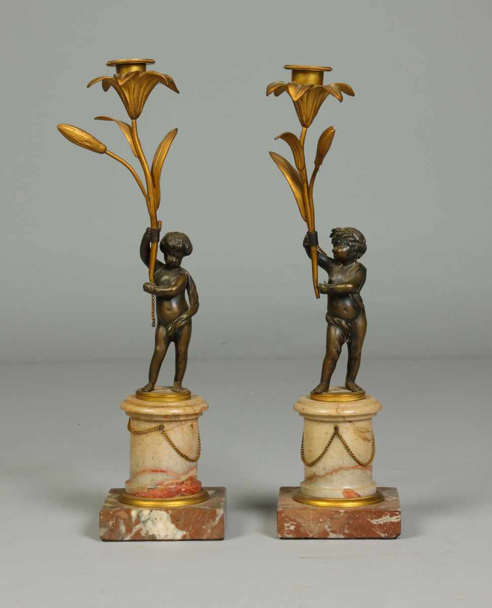 Appraisal: Pair of Marble Bronze Candle Holders w Cherubs Very good