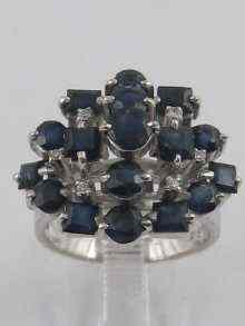 Appraisal: A white metal tests ct gold sapphire and diamond cluster