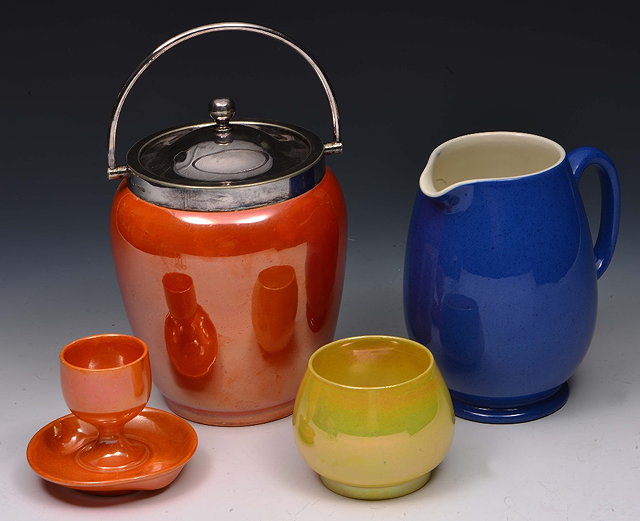 Appraisal: Four pieces of Moorcroft lustre wareto include an orange jar