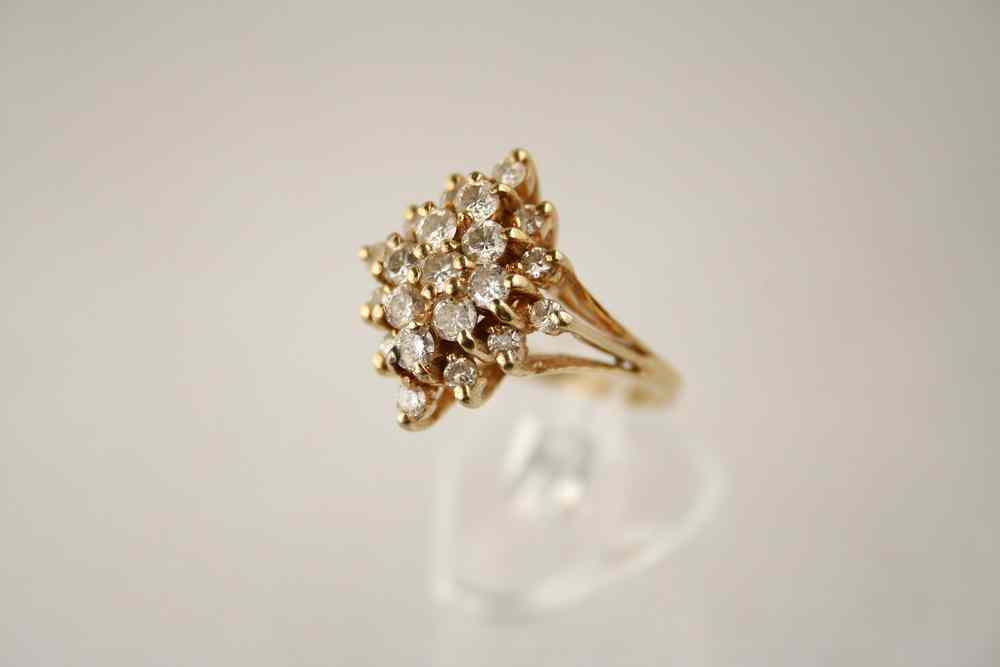 Appraisal: LADY'S RING - One K yellow gold and diamond cluster