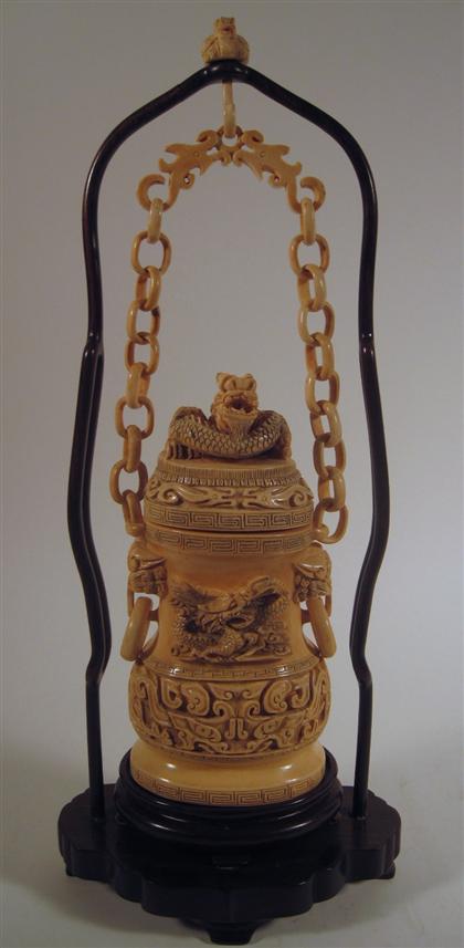 Appraisal: Chinese elephant ivory covered hanging vase with wood standChain-link supported