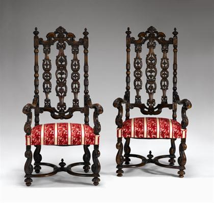 Appraisal: Pair of Renaissance style walnut armchairs With pierced carved backrests