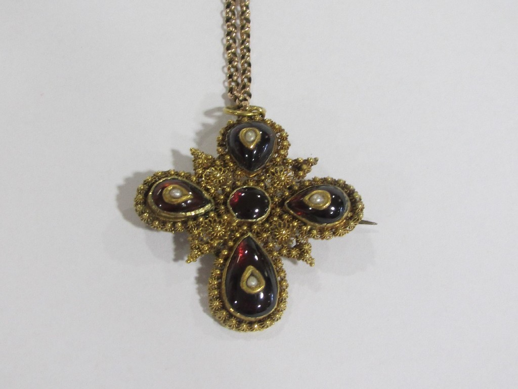 Appraisal: Yellow metal filigree work cross pendant set with cabochon garnets