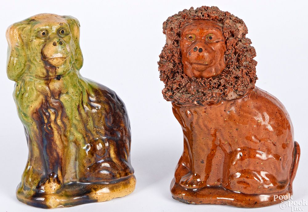 Appraisal: Two Pennsylvania Wagner pottery redware spaniels Two Pennsylvania Wagner pottery