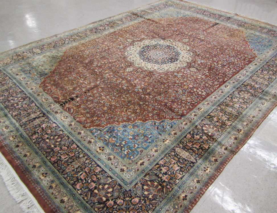 Appraisal: HAND KNOTTED ORIENTAL CARPET Pakistani-Persian floral and central floral medallion