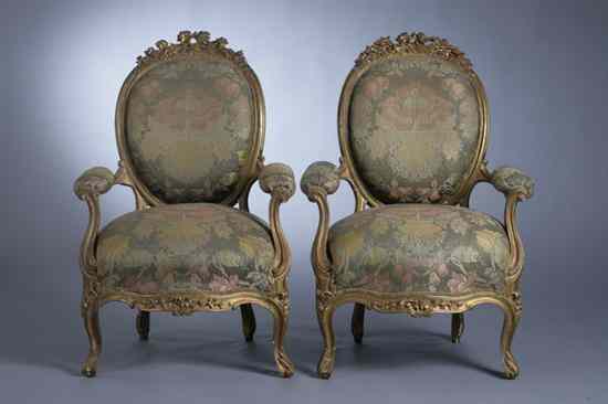 Appraisal: PAIR LOUIS XV STYLE CARVED AND GILT UPHOLSTERED FAUTEUILS th