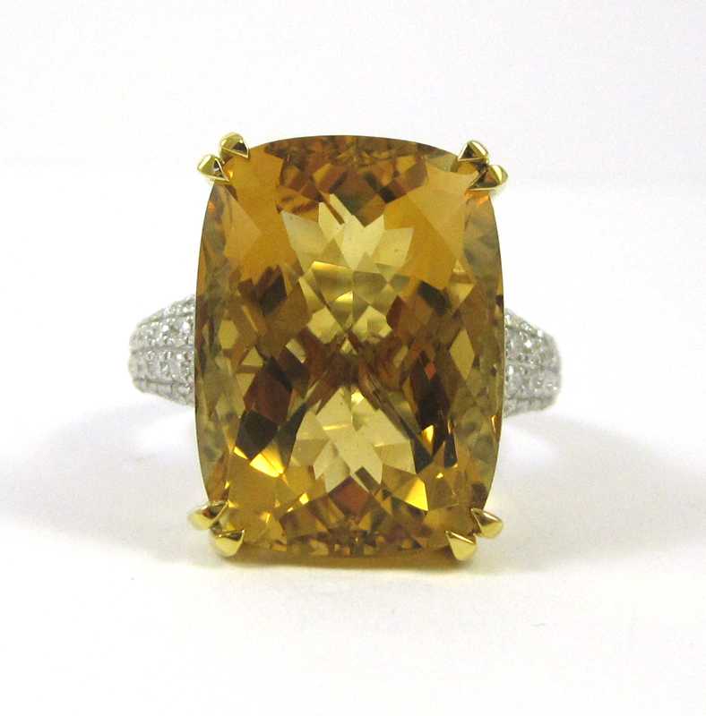 Appraisal: FOURTEEN KARAT GOLD DIAMOND AND CITRINE RING round-cut diamonds on