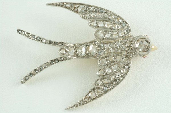 Appraisal: Diamond bird pendant in plantinum and K yellow gold One