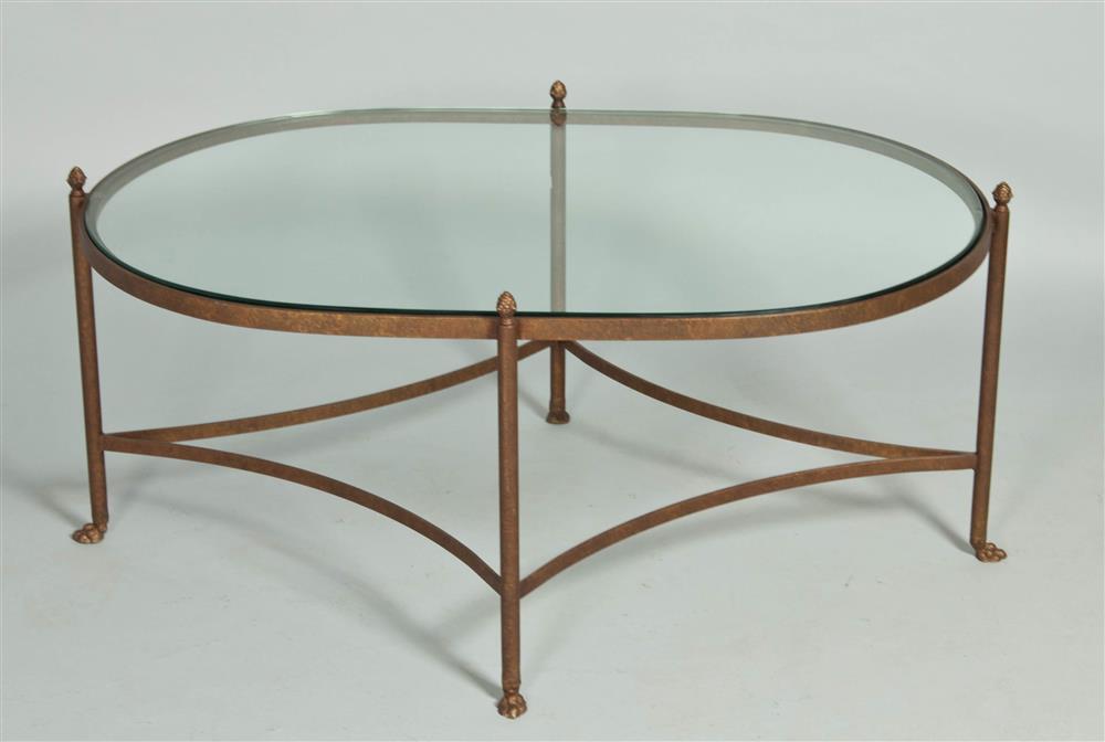 Appraisal: OVAL COFFEE TABLE WITH GLASS TOP in glass inset within