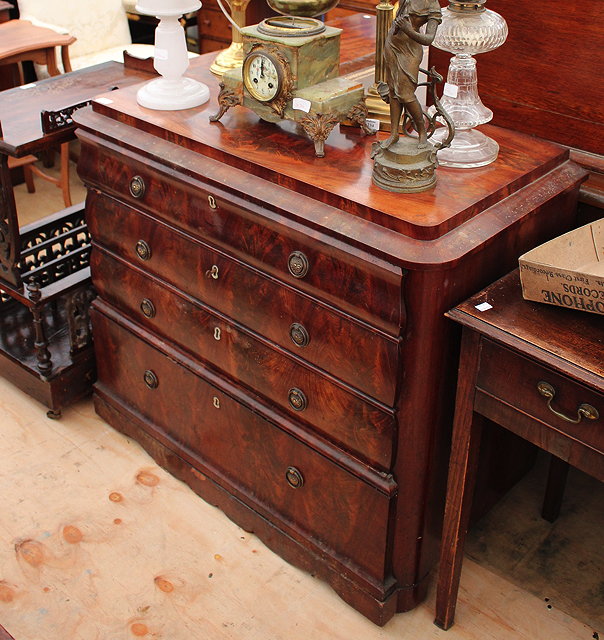 Appraisal: AN TH TH CENTURY MAHOGANY COMMODE of three serpentine fronted