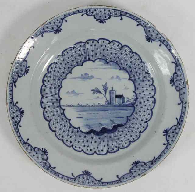 Appraisal: A blue and white Delftware dish decorated a house and