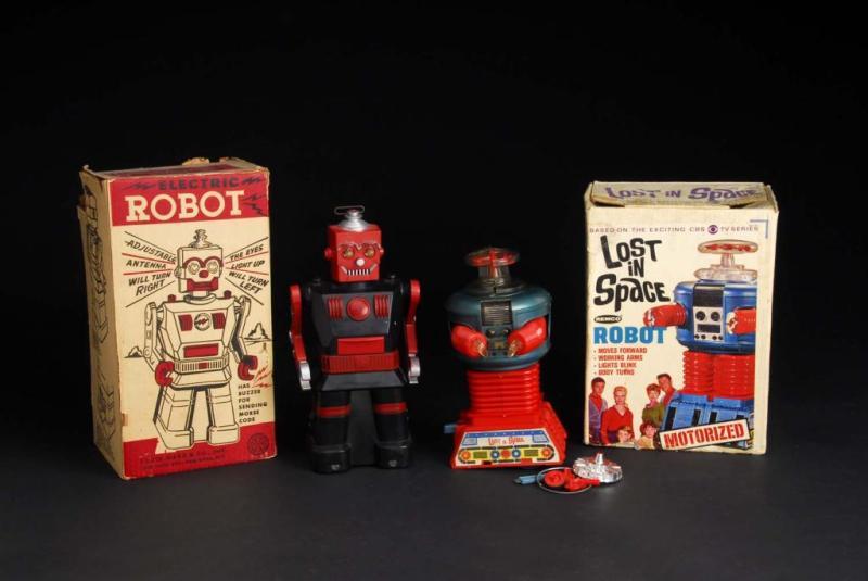 Appraisal: Lot of Lost in Space Electric Robot Toys Description Plastic