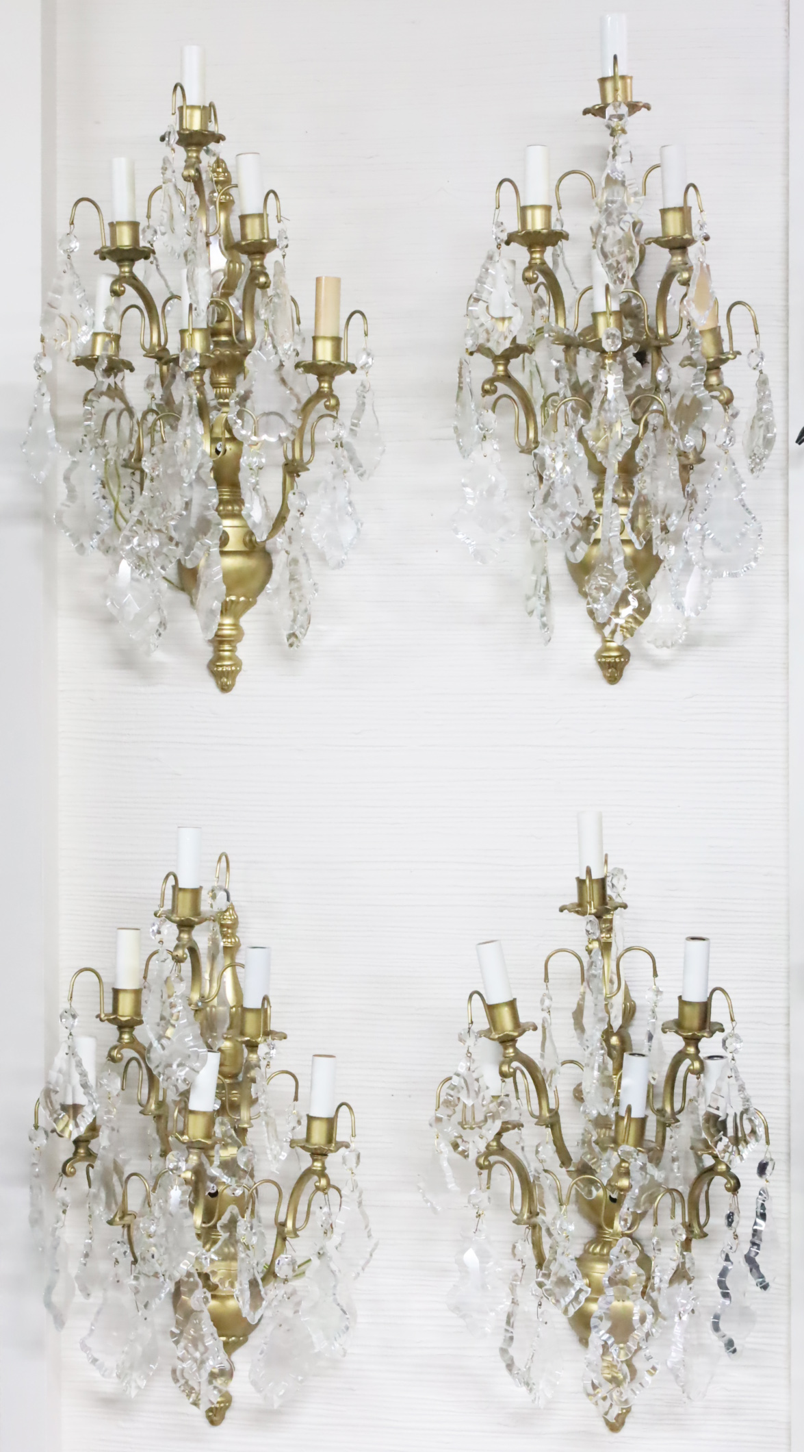 Appraisal: GROUP OF FIVE LIGHT CRYSTAL WALL SCONCES Group of gilded