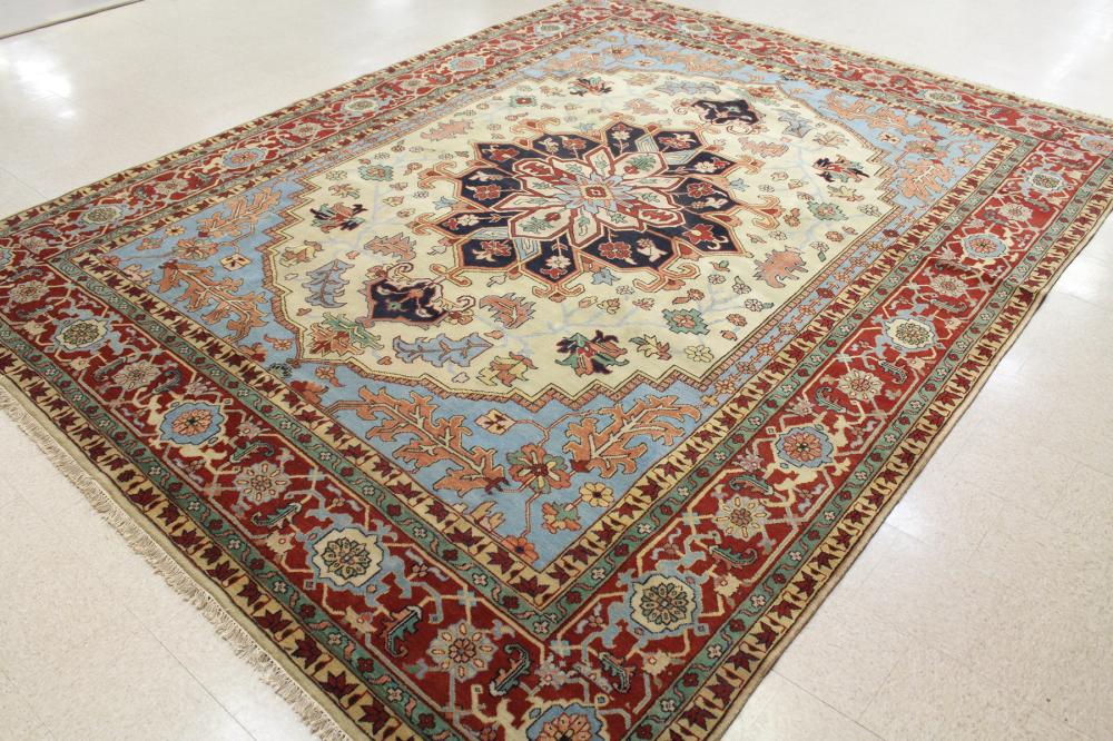 Appraisal: LARGE HAND KNOTTED ORIENTAL CARPET Persian Heriz design with central