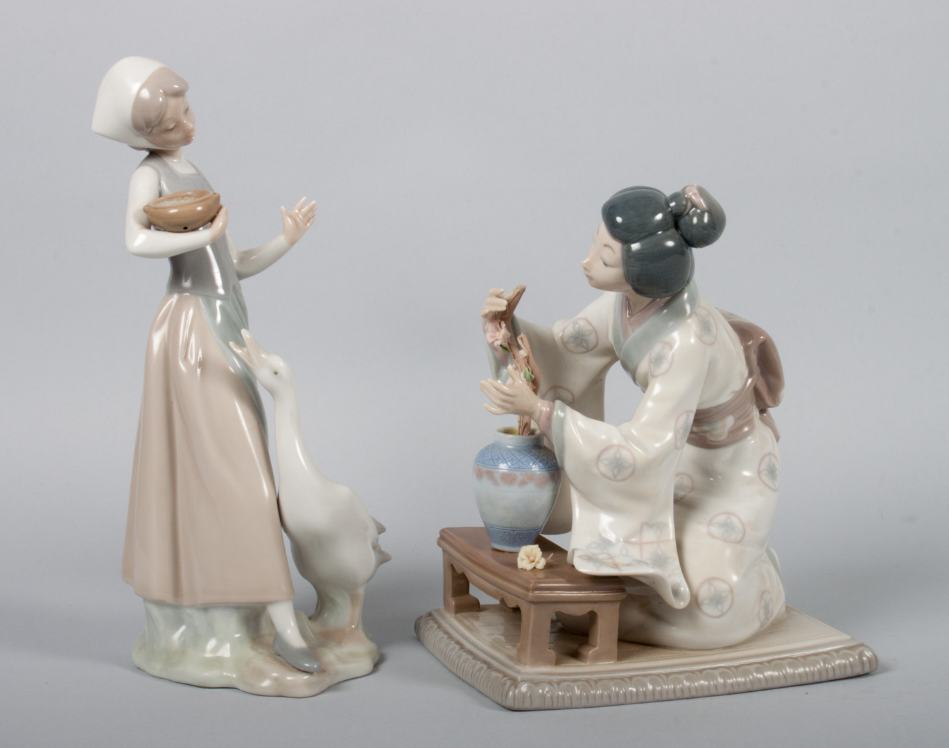 Appraisal: Two Lladro porcelain figures Japanese Flower Arranger approx in H