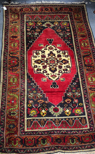 Appraisal: AN ORIENTAL BLUE GROUND CARPET with central medallion in multiple