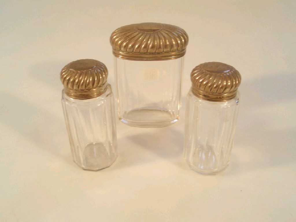 Appraisal: Three silver topped Victorian dressing table jars