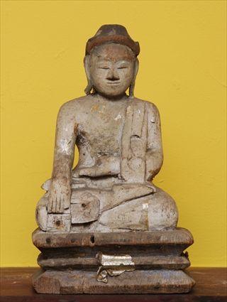 Appraisal: SOUTHEAST ASIAN CARVED FIGURE OF BUDDHA Seated in lotus position