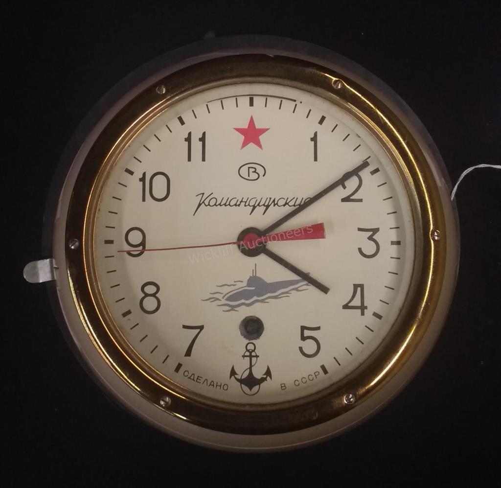 Appraisal: A Russian submarine clock labeled Made in Russia verso with