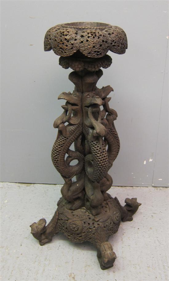 Appraisal: th century Burmese hard wood stand profusely carved throughout with