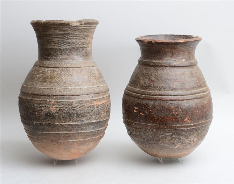 Appraisal: TWO SIMILAR ANCIENT MESOPOTAMIAN INCISED POTTERY LARGE VESSELS Each ovoid